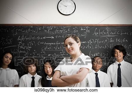 Stock Image - Students in front of blackboard. Fotosearch