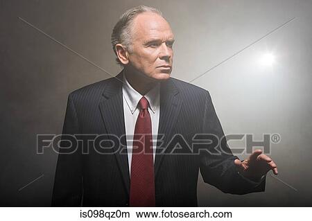 Businessman in smoke View Large Photo Image Picture - Businessman in smoke. Fotosearch