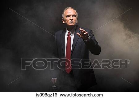 Businessman in smoke View Large Photo Image Stock Photograph - Businessman in smoke. Fotosearch