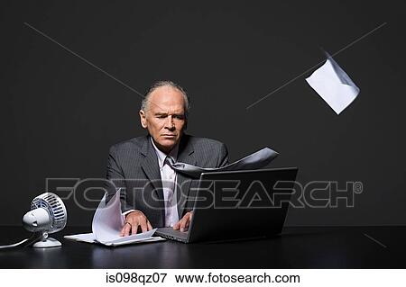 Stock Photo - Businessman with fan. Fotosearch