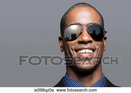 Businessman with reflection in sunglasses View Large Photo Image Stock Image - Businessman with reflection in sunglasses. Fotosearch