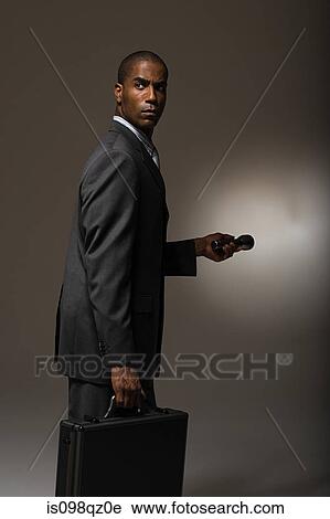 Businessman with torch View Large Photo Image Stock Image - Businessman with torch. Fotosearch