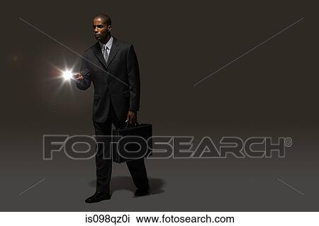 Businessman with torch View Large Photo Image Stock Image - Businessman with torch. Fotosearch
