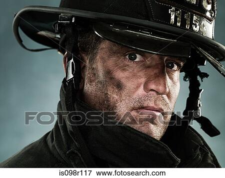 Stock Photo - Portrait of a firefighter. Fotosearch