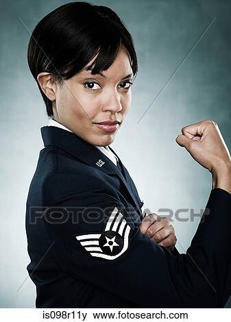 Stock Photo - Portrait of an air woman flexing her muscles. Fotosearch