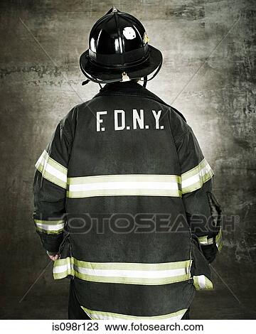 Stock Image - Rear view of a firefighter. Fotosearch