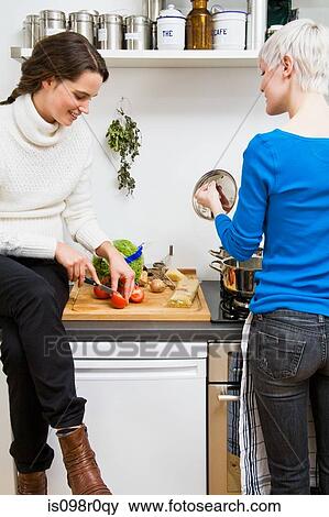 A lesbian couple cooking View Large Photo Image Stock Photo - A lesbian couple cooking. Fotosearch
