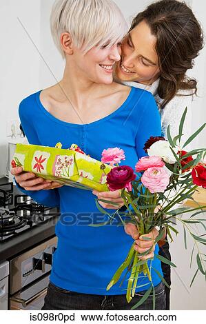 A lesbian couple giving gifts View Large Photo Image Stock Image - A lesbian couple giving gifts. Fotosearch