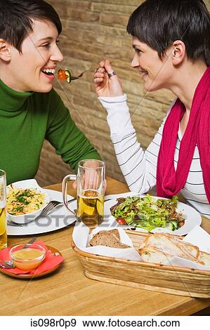 A lesbian couple having a meal View Large Photo Image Stock Photo - A lesbian couple having a meal. Fotosearch