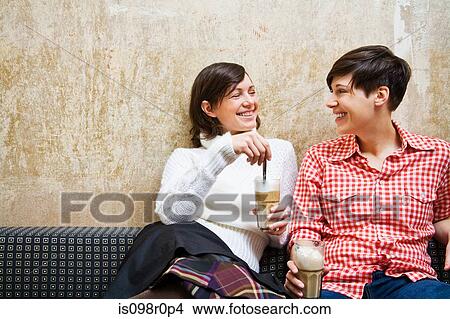 A lesbian couple having coffee View Large Photo Image Picture - A lesbian couple having coffee. Fotosearch