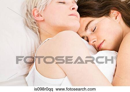 A lesbian couple sleeping View Large Photo Image Stock Photography - A lesbian couple sleeping. Fotosearch