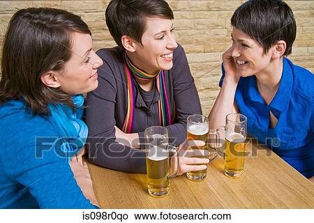 Friends in a pub View Large Photo Image Picture - Friends in a pub. Fotosearch