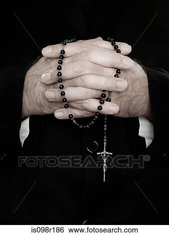 A close up of priest holding prayer beads View Large Photo Image Stock Photograph - A close up of priest holding prayer beads. Fotosearch