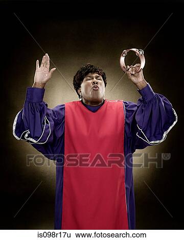 Stock Photograph - A gospel singer singing. Fotosearch
