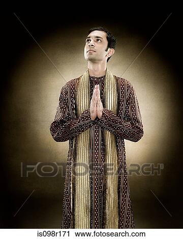 A hindu man praying View Large Photo Image Stock Image - A hindu man praying. Fotosearch