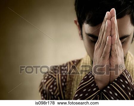 A hindu man praying View Large Photo Image Stock Photo - A hindu man praying. Fotosearch