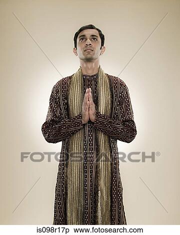 A hindu man praying View Large Photo Image Stock Photography - A hindu man praying. Fotosearch