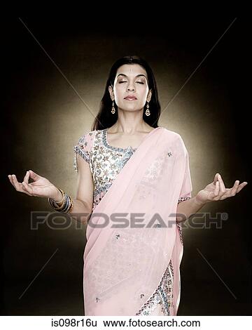 A hindu woman meditating View Large Photo Image Stock Photograph - A hindu woman meditating. Fotosearch