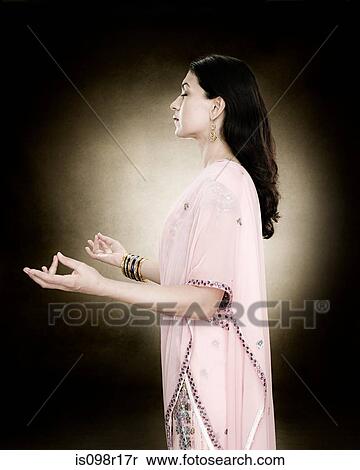 A hindu woman meditating View Large Photo Image Stock Photography - A hindu woman meditating. Fotosearch