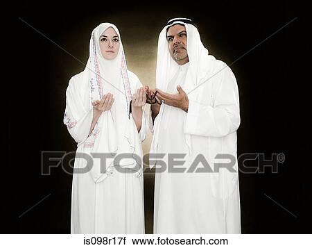 A man and woman holding prayer beads View Large Photo Image Stock Image - A man and woman holding prayer beads. Fotosearch