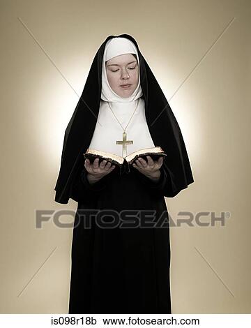 A nun reading a bible View Large Photo Image Stock Image - A nun reading a bible. Fotosearch