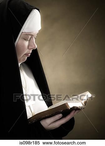 A nun reading a bible View Large Photo Image Stock Photography - A nun reading a bible. Fotosearch
