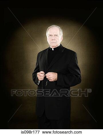 A priest holding prayer beads View Large Photo Image Stock Photo - A priest holding prayer beads. Fotosearch