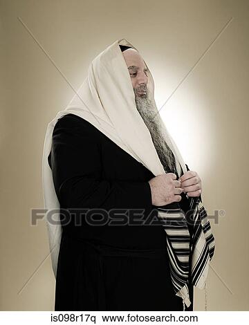 A rabbi wearing a prayer shawl View Large Photo Image Stock Photography - A rabbi wearing a prayer shawl. Fotosearch