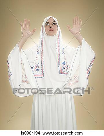 A young muslim woman praying View Large Photo Image Picture - A young muslim woman praying. Fotosearch