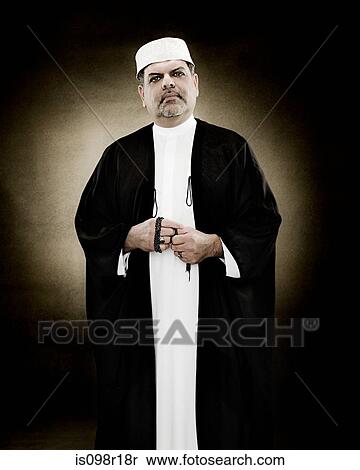 Portrait of a muslim man holding prayer beads View Large Photo Image Stock Photography - Portrait of a muslim man holding prayer beads. Fotosearch