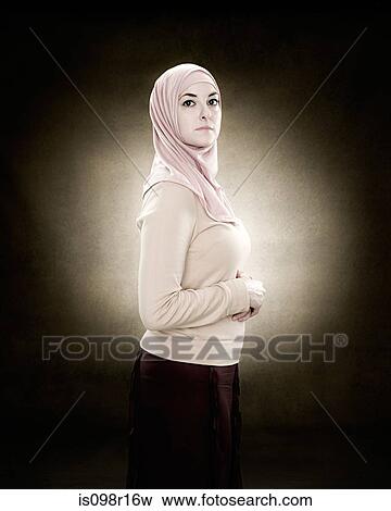 Portrait of a young muslim woman View Large Photo Image Stock Photo - Portrait of a young muslim woman. Fotosearch