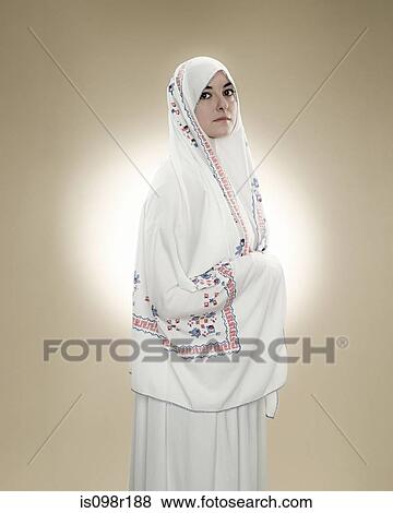 Portrait of a young muslim woman View Large Photo Image Stock Photo - Portrait of a young muslim woman. Fotosearch