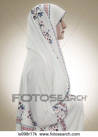 Profile of a young muslim woman View Large Photo Image Stock Image - Profile of a young muslim woman. Fotosearch