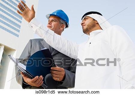 Stock Photography - An architect and a middle eastern businessman. Fotosearch