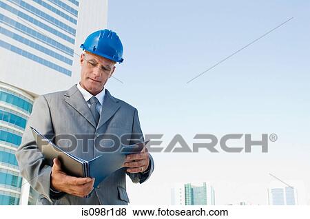 An architect reading a book View Large Photo Image Stock Photo - An architect reading a book. Fotosearch
