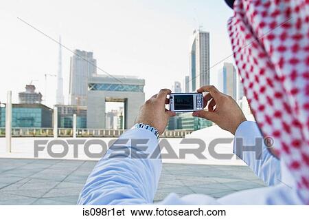 Businessman taking pictures View Large Photo Image Stock Photograph - Businessman taking pictures. Fotosearch