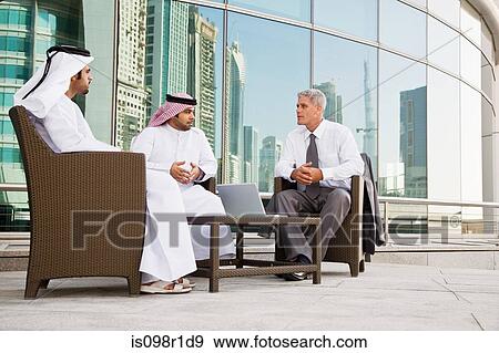 Businessmen having a meeting View Large Photo Image Stock Photo - Businessmen having a meeting. Fotosearch