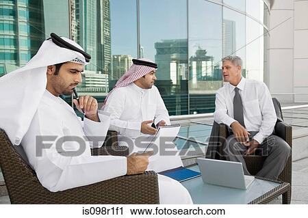 Businessmen in a meeting View Large Photo Image Stock Image - Businessmen in a meeting. Fotosearch