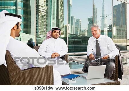 Businessmen in a meeting View Large Photo Image Stock Photo - Businessmen in a meeting. Fotosearch