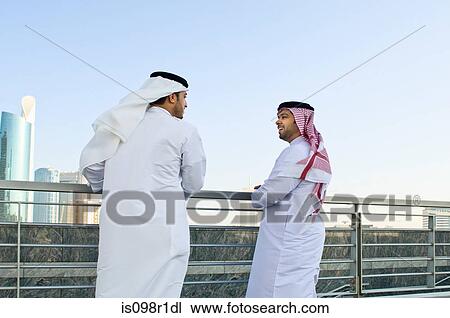 Stock Image - Businessmen talking. Fotosearch