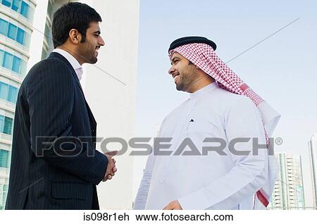 Businessmen talking View Large Photo Image Stock Image - Businessmen talking. Fotosearch