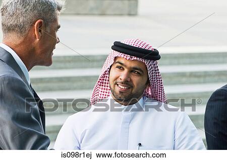 Businessmen talking View Large Photo Image Stock Image - Businessmen talking. Fotosearch