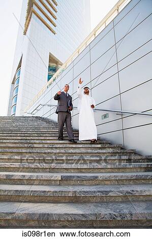 Businessmen walking down steps View Large Photo Image Picture - Businessmen walking down steps. Fotosearch