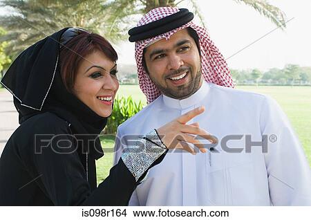 A couple in a park View Large Photo Image Picture - A couple in a park. Fotosearch