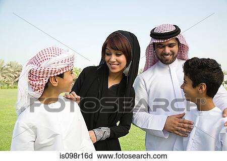 A family in a park View Large Photo Image Stock Image - A family in a park. Fotosearch
