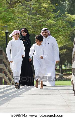 Stock Photo - Boys running along a bridge. Fotosearch