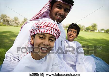 Stock Image - Portrait of a father with his sons. Fotosearch