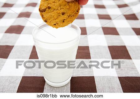 A cookie and milk View Large Photo Image Stock Image - A cookie and milk. Fotosearch