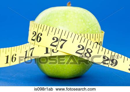 A tape measure wrapped around an apple View Large Photo Image Stock Image - A tape measure wrapped around an apple. Fotosearch