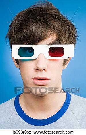 A teenage boy wearing 3d glasses View Large Photo Image Stock Photo - A teenage boy wearing 3d glasses. Fotosearch